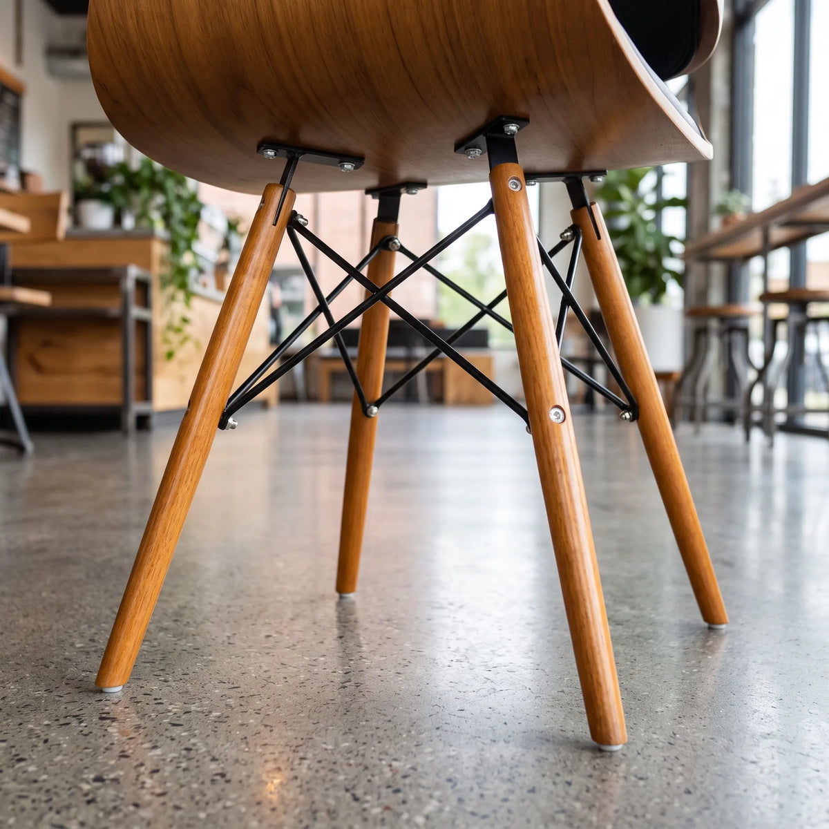 Product view of a modern wood-look dining side chair