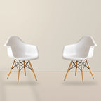 Two white Eames DAW dining armchairs with beech wood legs, illustrative studio set of 2